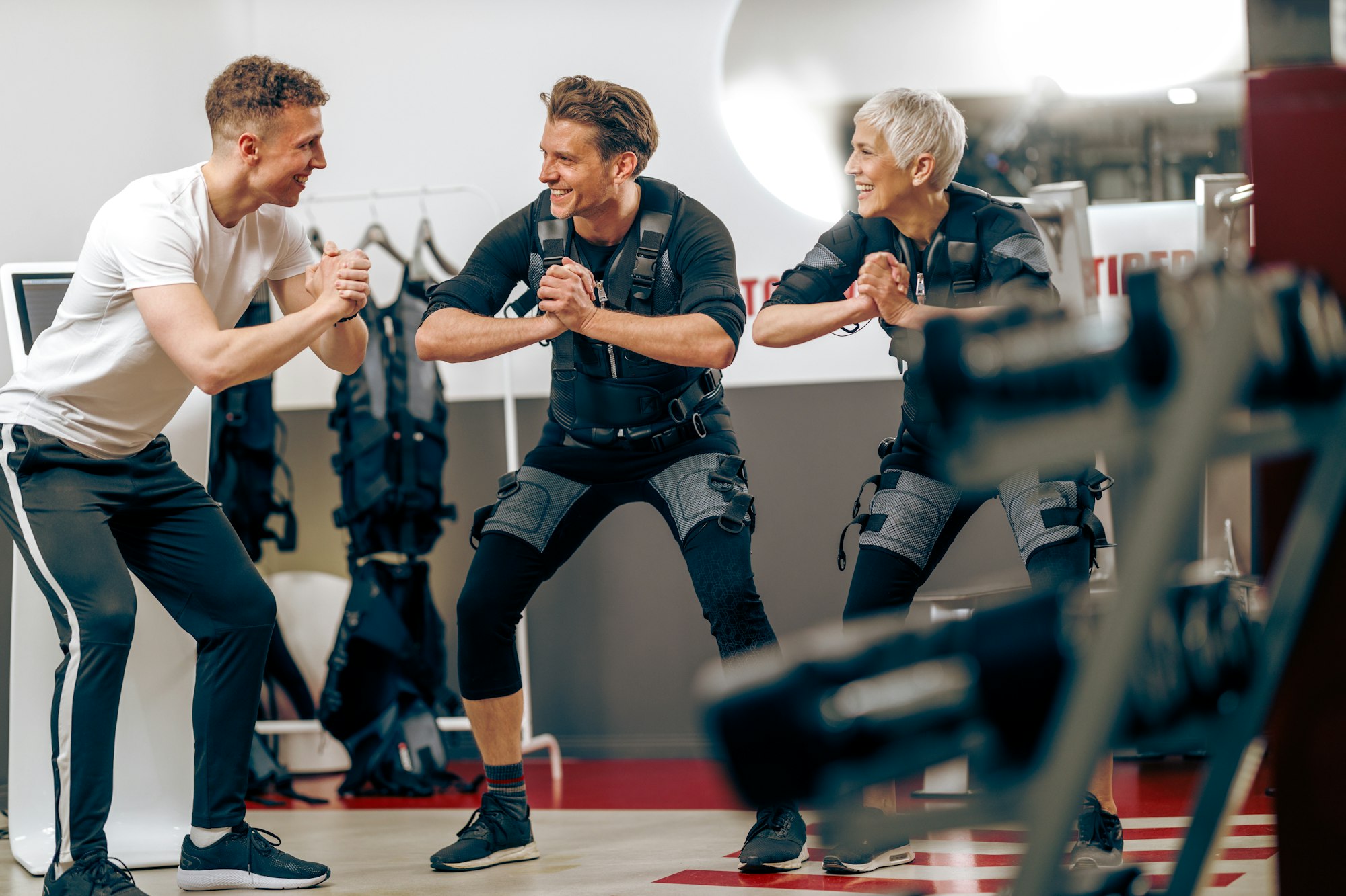 Mom And Son On EMS Training At The Gym