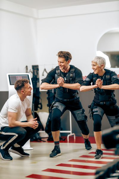 Mom And Son On EMS Training At The Gym